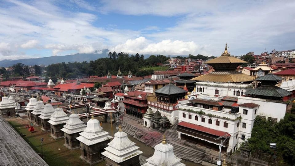 Pashupatinath: Evening tour of temple and Aarati ceremony - The Aarati ceremony near the river: oil lamps, mantras, and drums
