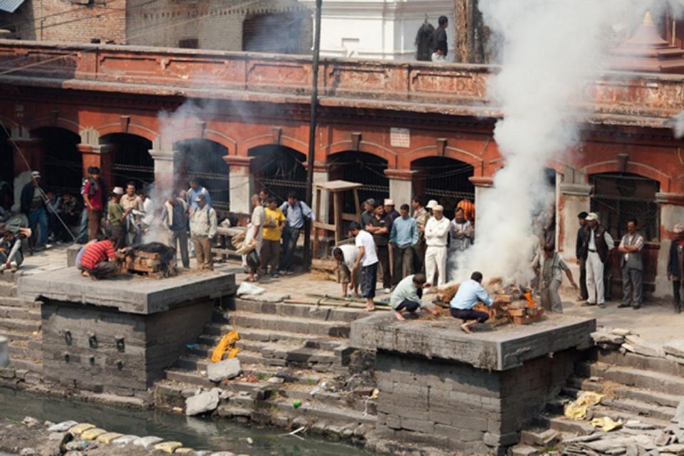 Sacred Pashupatinath: Aarati,Cremation Rites & Boudha Stupa - Aarati ceremony atmosphere: chants, bells, and conch shells
